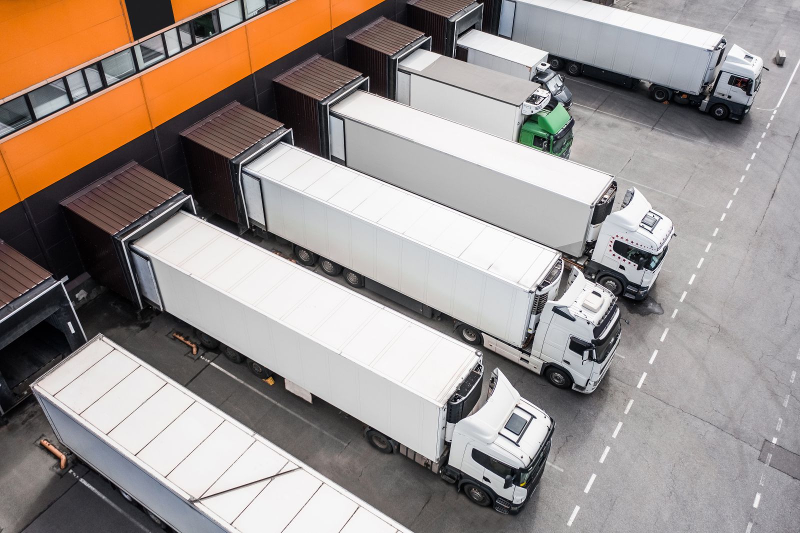 Electric trucks operating at a manufacturing facility and distribution center